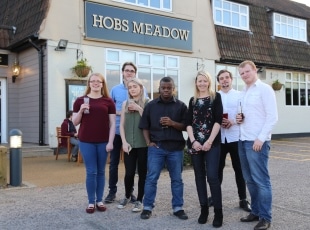 Performing Art students in front of pub