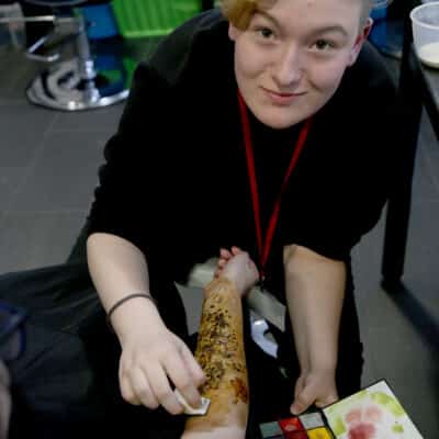 Keelin creating authentic injury make up in the studio.