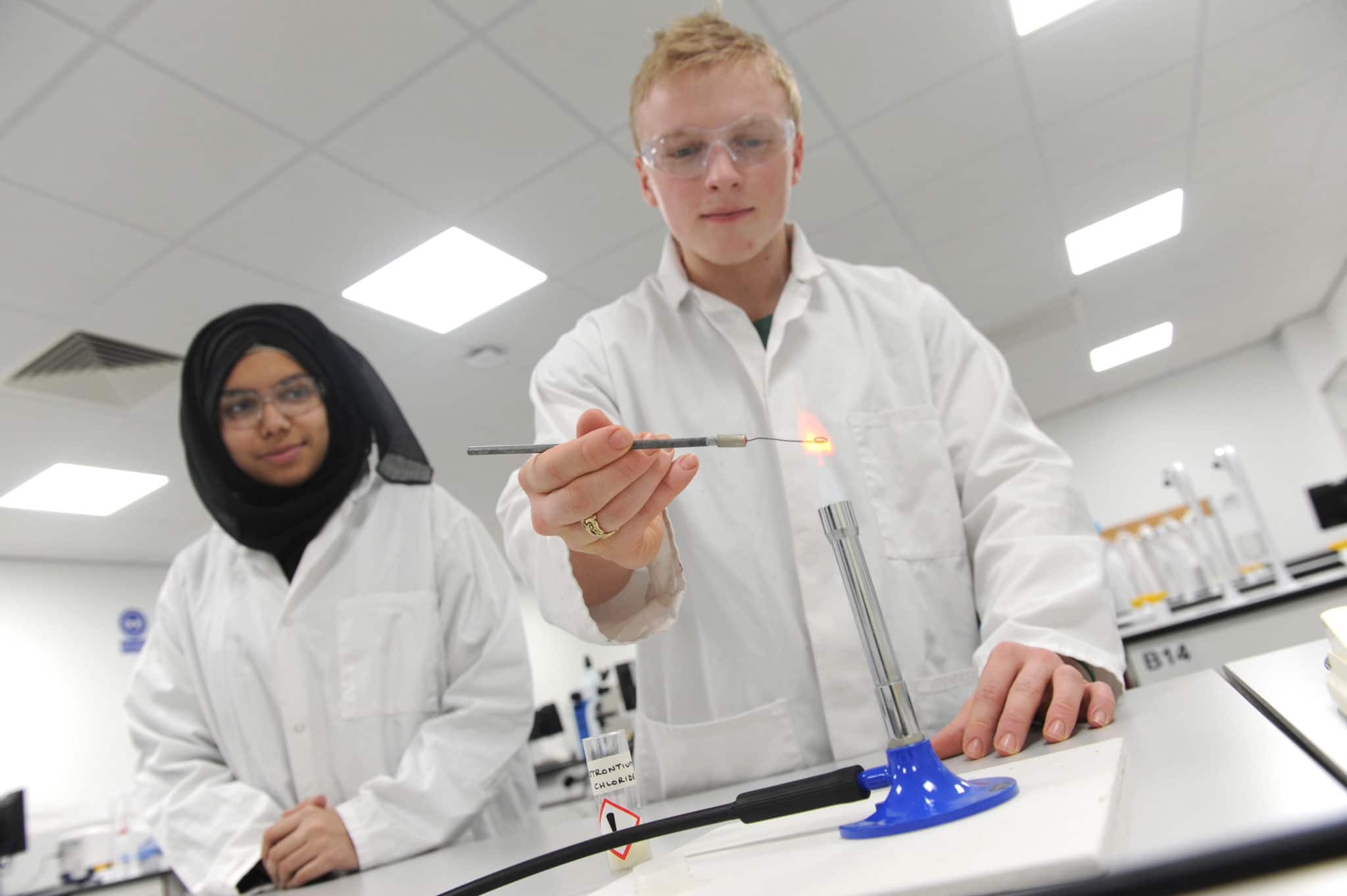 students using a bunsen burner