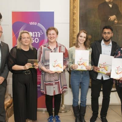 Tutor with students at award night