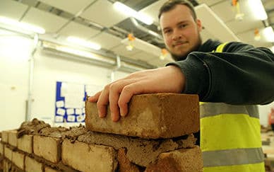 Rob constructing a wall