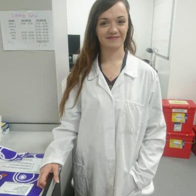 girl in a lab coat in a lab