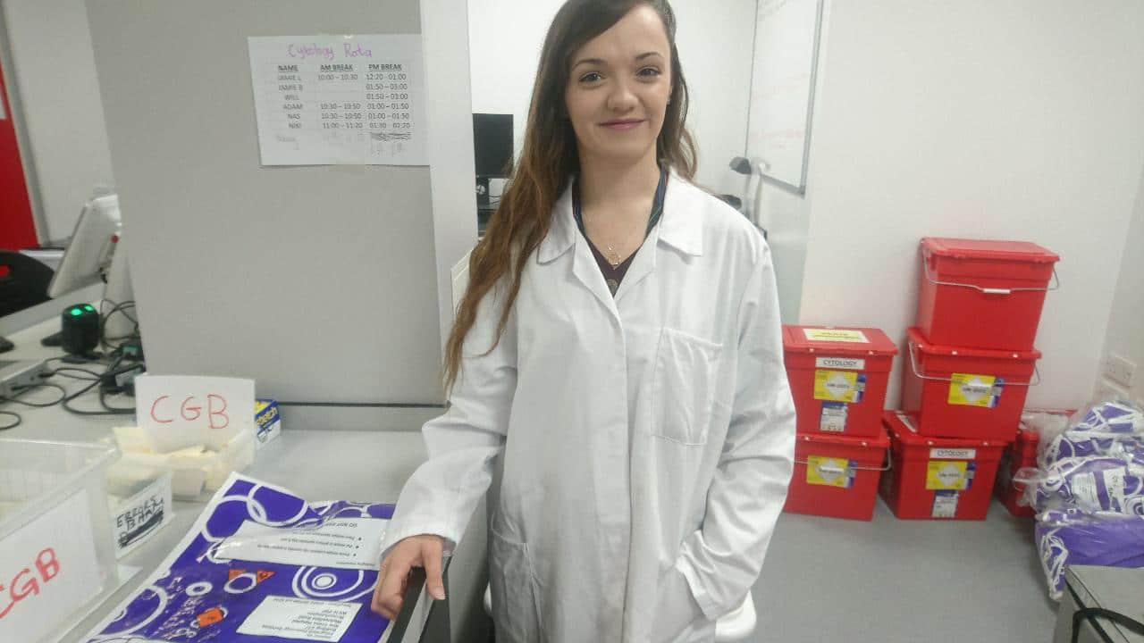 girl in a lab coat in a lab