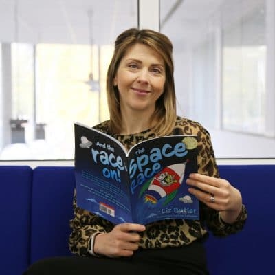 Women sat with an open book