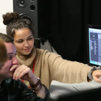students in studio on a mac
