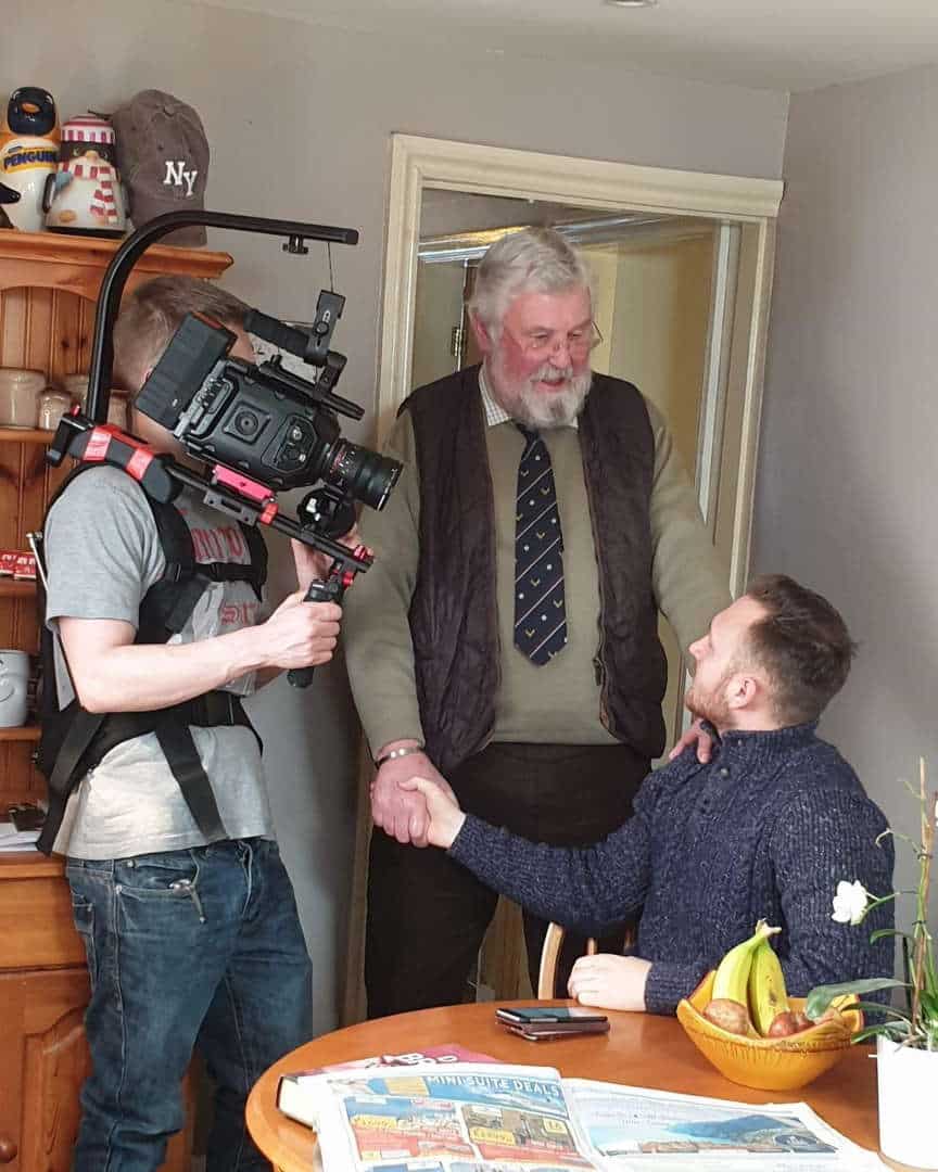 Student films greeting between two men. Photos by Jemma Kinzett, Daniel Charlton, Samantha Elston, Elliot Roberts.