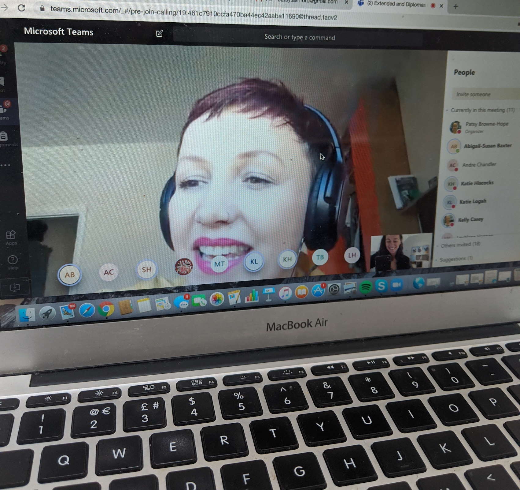 Laptop showing image of online class