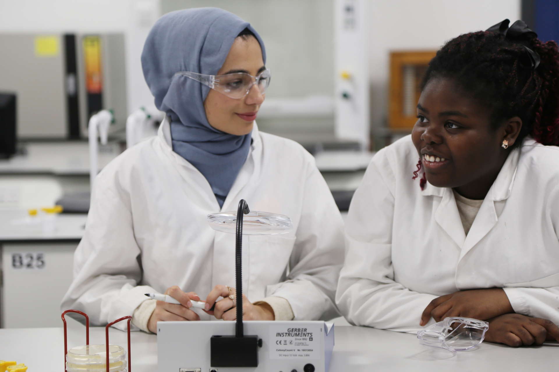 Science students in lab coats.