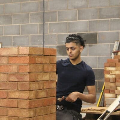 a student builds a wall