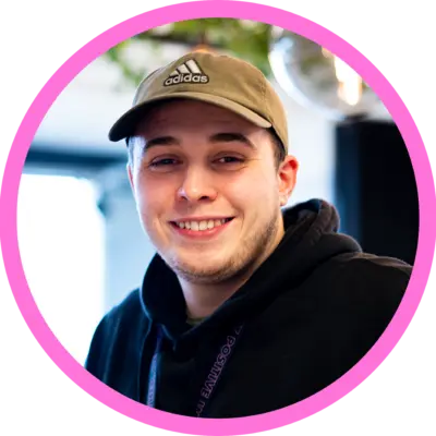 Dan Charlton picture, Dan wears a cap and smiles at the camera.