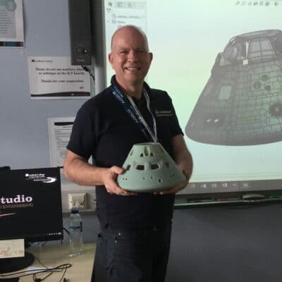 Mark Piatwoski stood in his classroom holding the model of the module