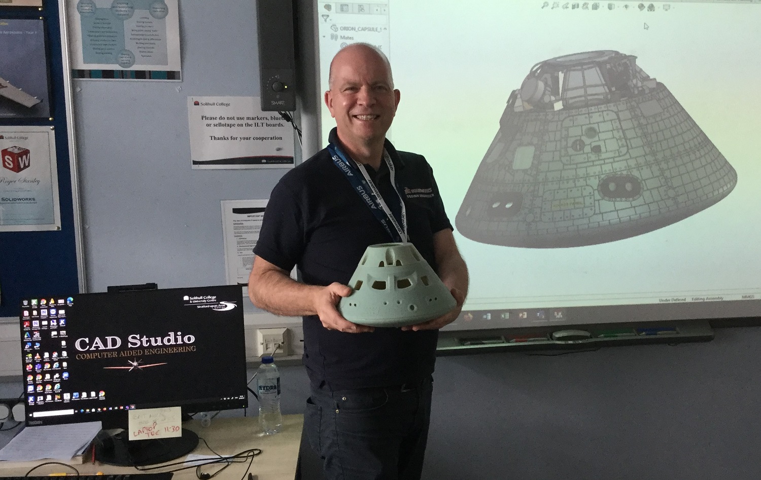 Mark Piatwoski stood in his classroom holding the model of the module
