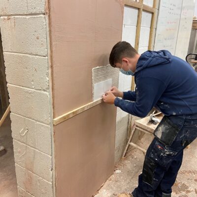 a student working on his tiling