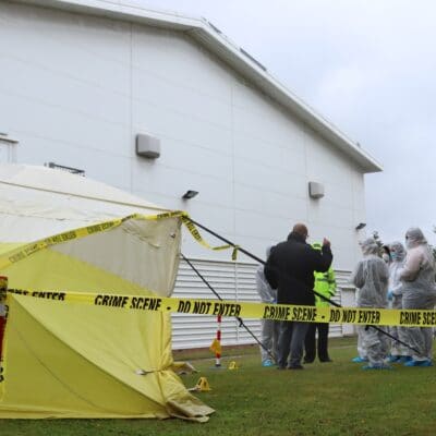 the crime scene set up outside blossomfield campus with a tent and crime scene tape