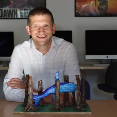 Lee Skinner with a clay model of the book's front cover.