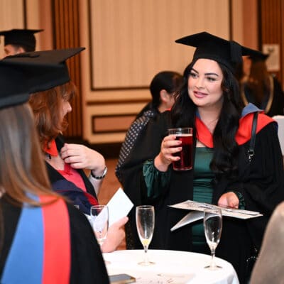 Graduates enjoying a drink celebrating graduation from solihull college