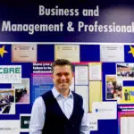 International businessperson visits College after 2 decades