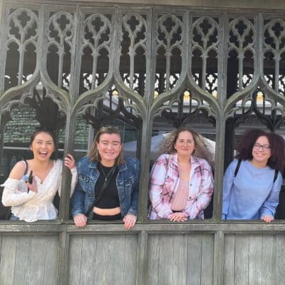 Four students smiling at camera