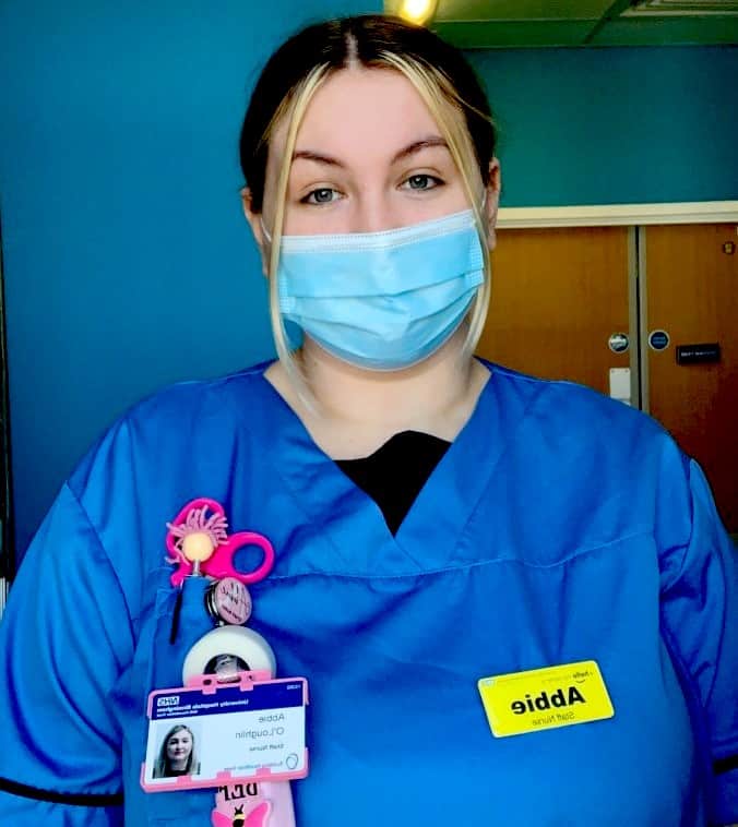 Nurse wearing scrubs and mask