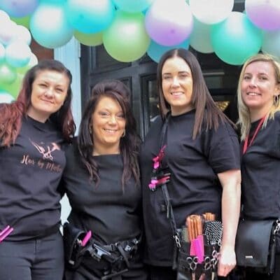 4 students looking at camera