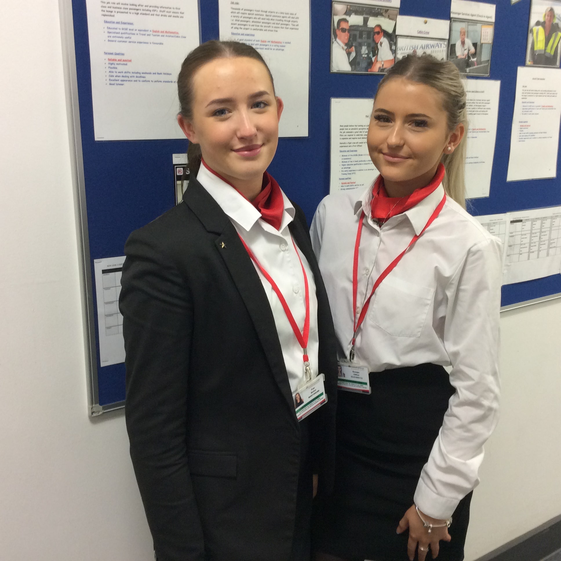 Two female cabin crew students wearing their uniform