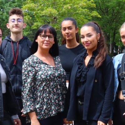 6 students standing next to each other