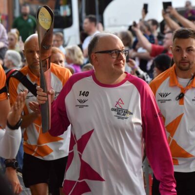 Andrew carrying the baton