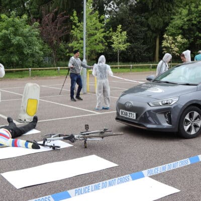Forensic students doing a variety of tasks during road traffic accident simulation.