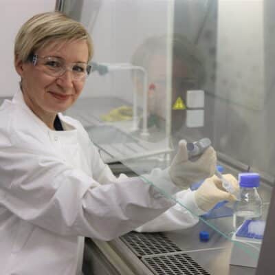 Claud in the science lab wearing a lab coat