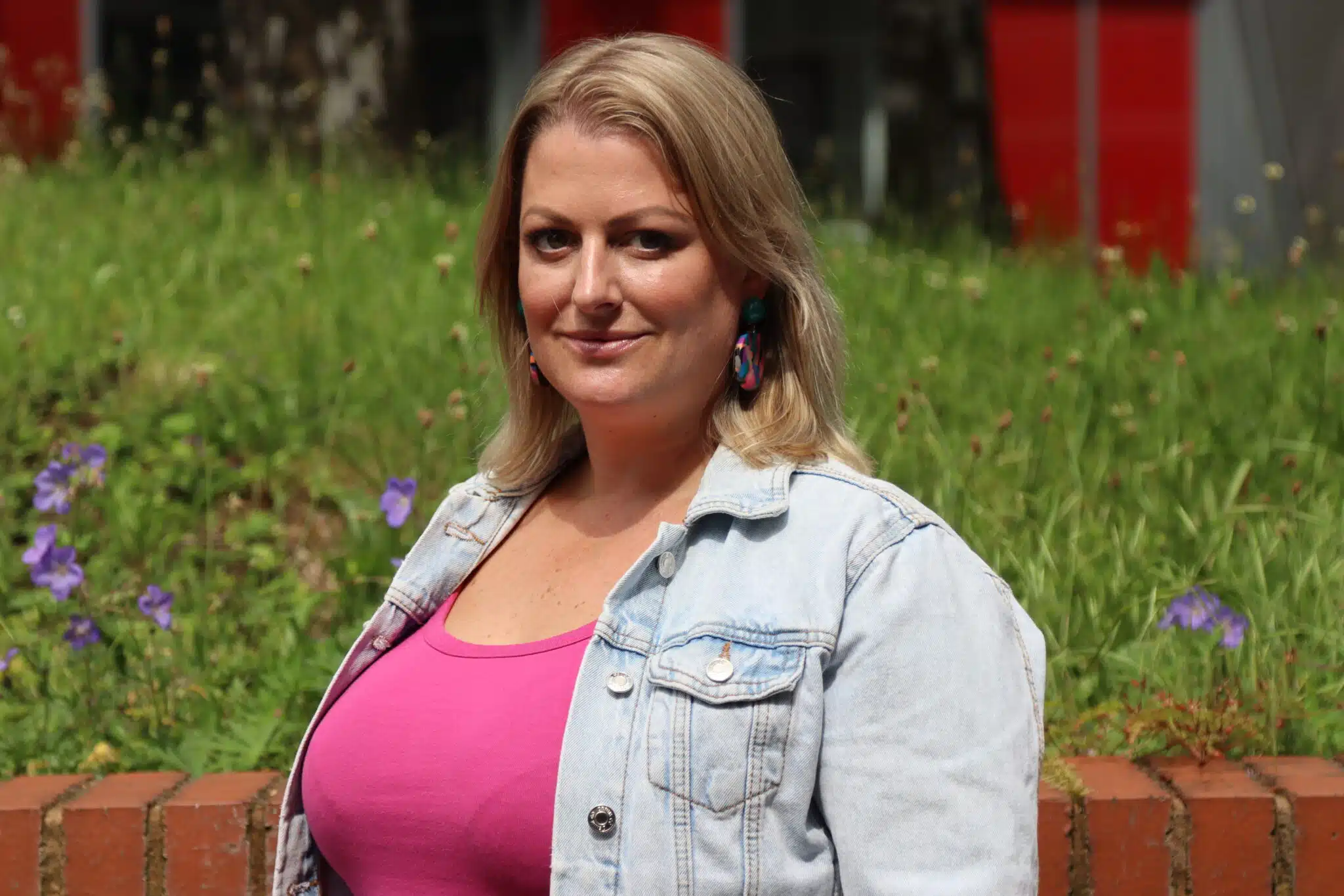 Maggiie standing outside the college