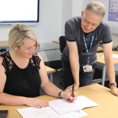 Maths lecturer helping student with maths