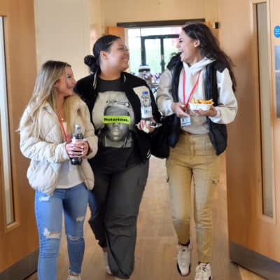 Photo of students celebrating College to launch A-Level offer