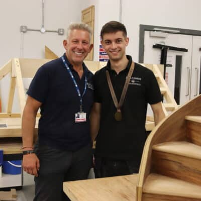 Harry in the woodwork studio at Woodlands Campus with tutor Arron Ward