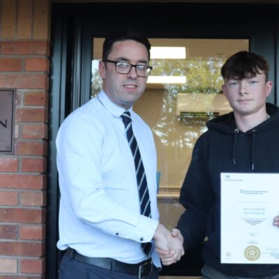 Drew with his certificate