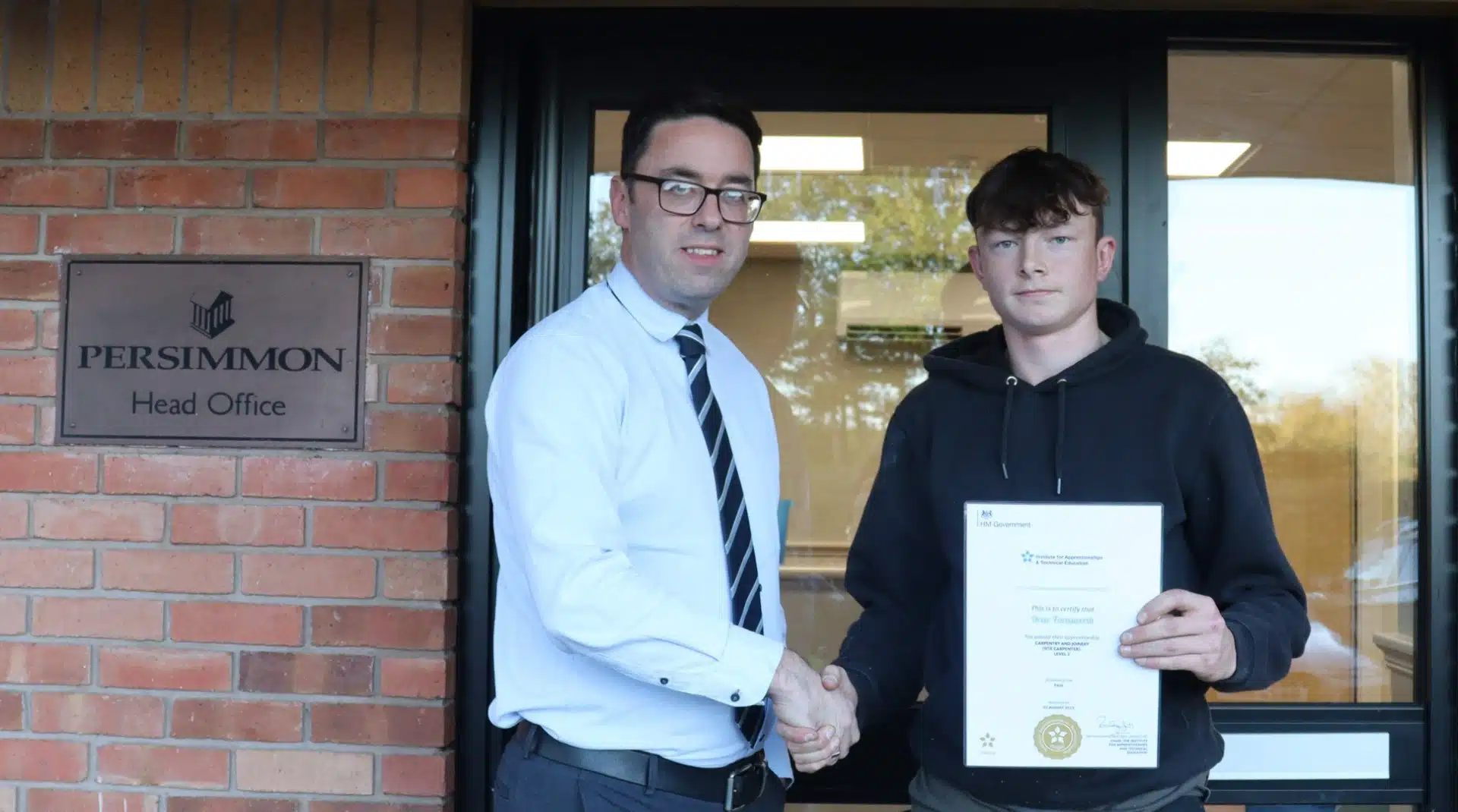 Drew with his certificate