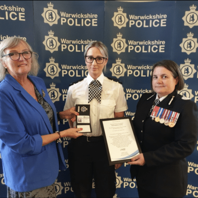 Heather receiving her warrant card