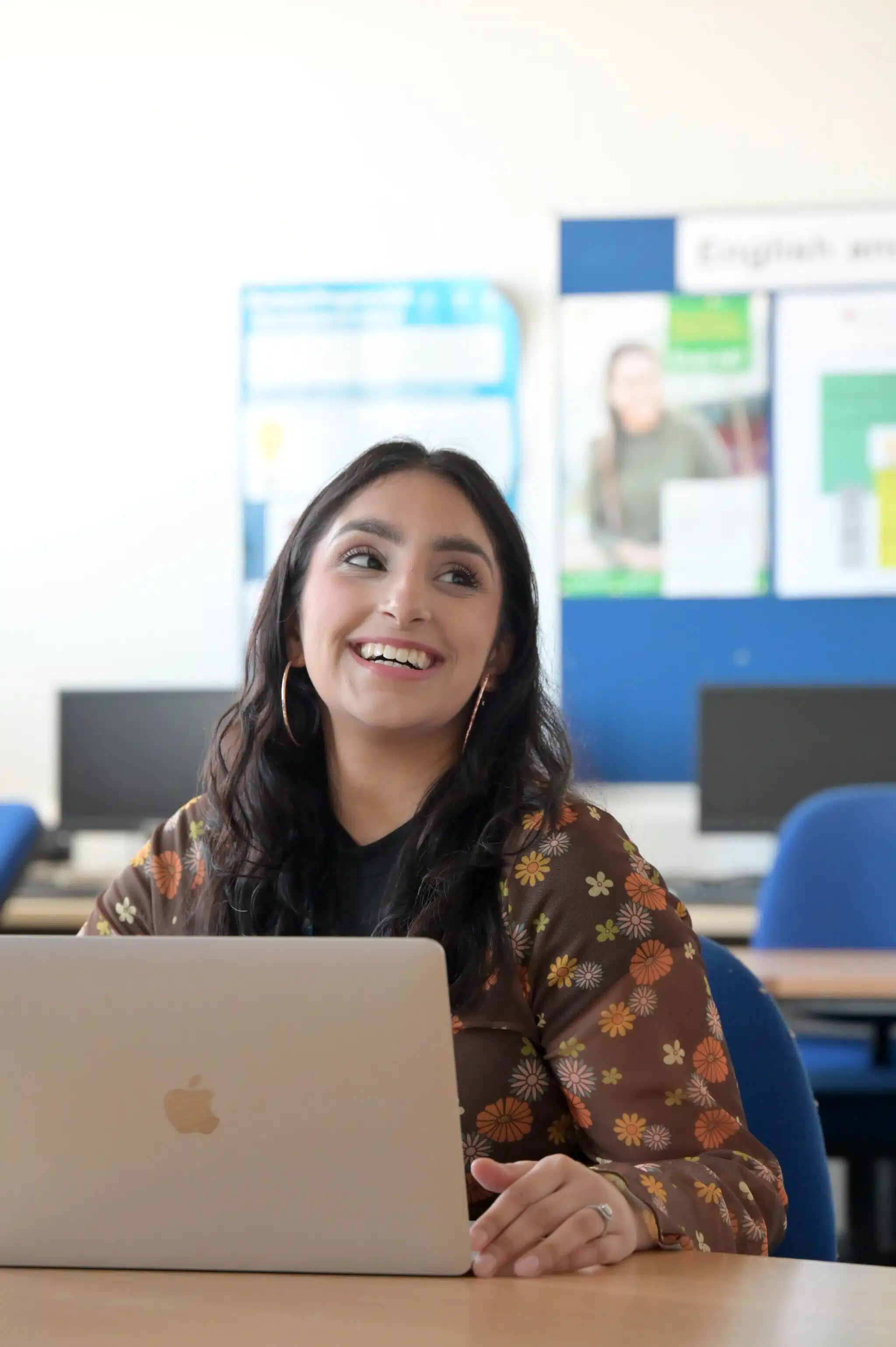 Student works at laptop.