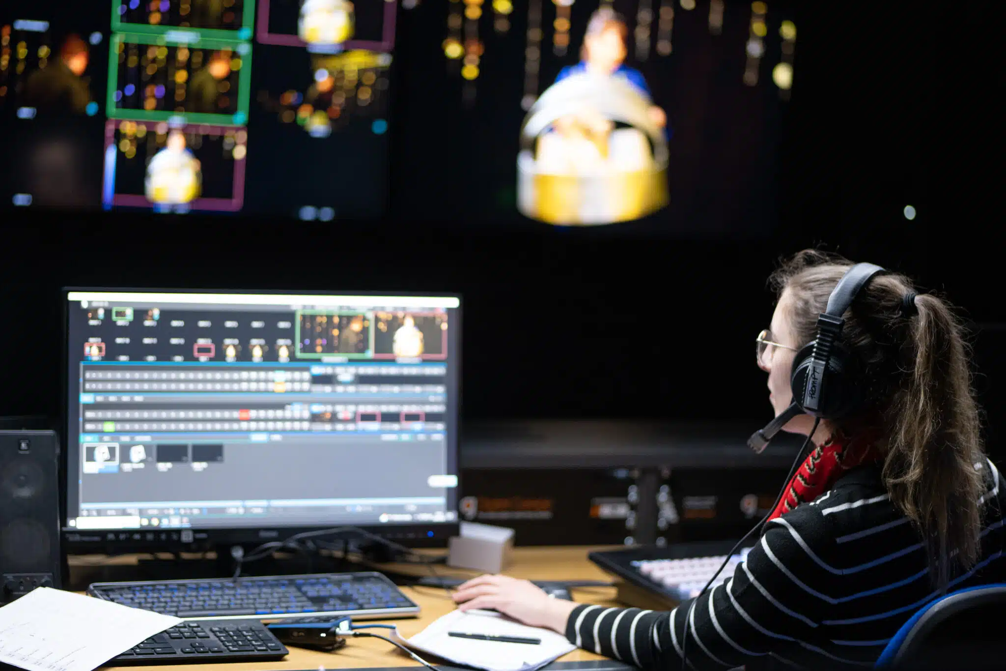 Student works at mixing desk.