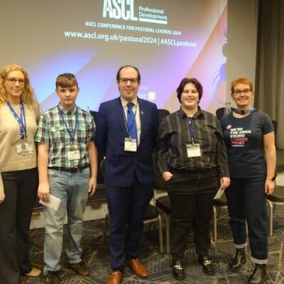 Caleb on stage after delivering a speech at a pastoral conference