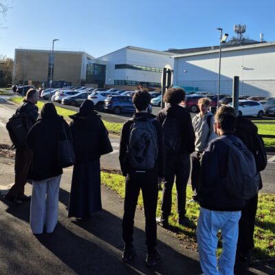 students outside checking out a mobile phone mast on top of Solihull College building