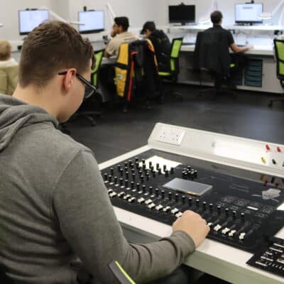Solihull College student working at a mixing desk