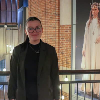 aine brown stood on balcony in RSC