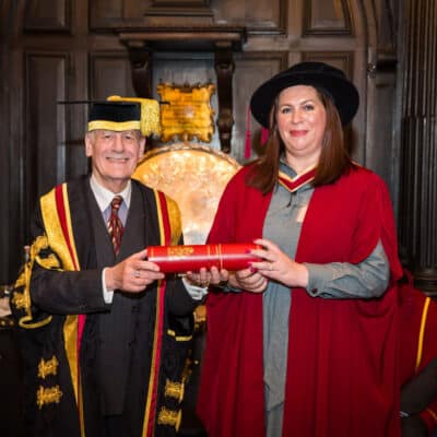 College Principal awarded prestigious Fellowship to Rebecca, who is receiving her certificate