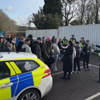 police car with students