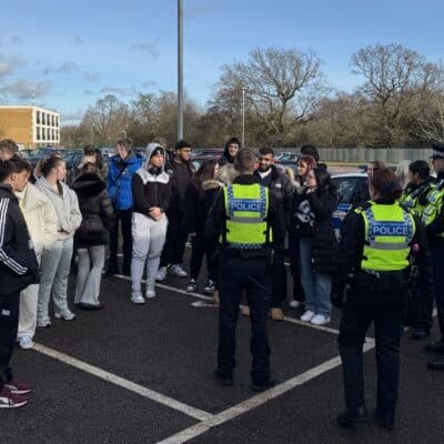 students in a car park with police having a lesson