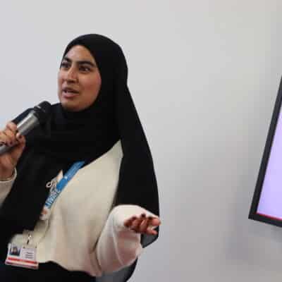 Student speaking in microphone