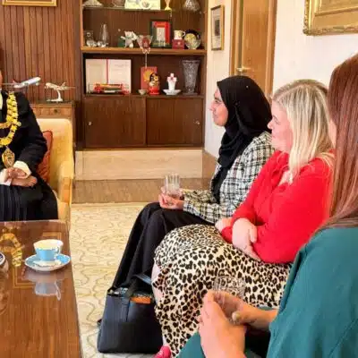 student voice president, Hayaat, speaking with the mayor