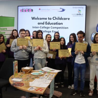 Students line up with their certificates after taking part in the competition