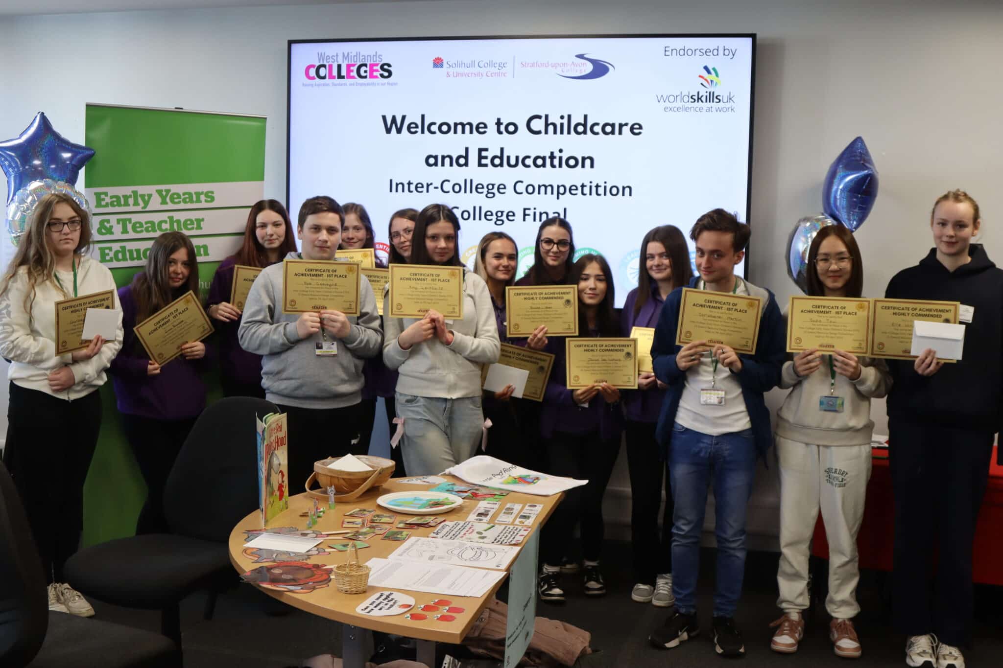 Students line up with their certificates after taking part in the competition