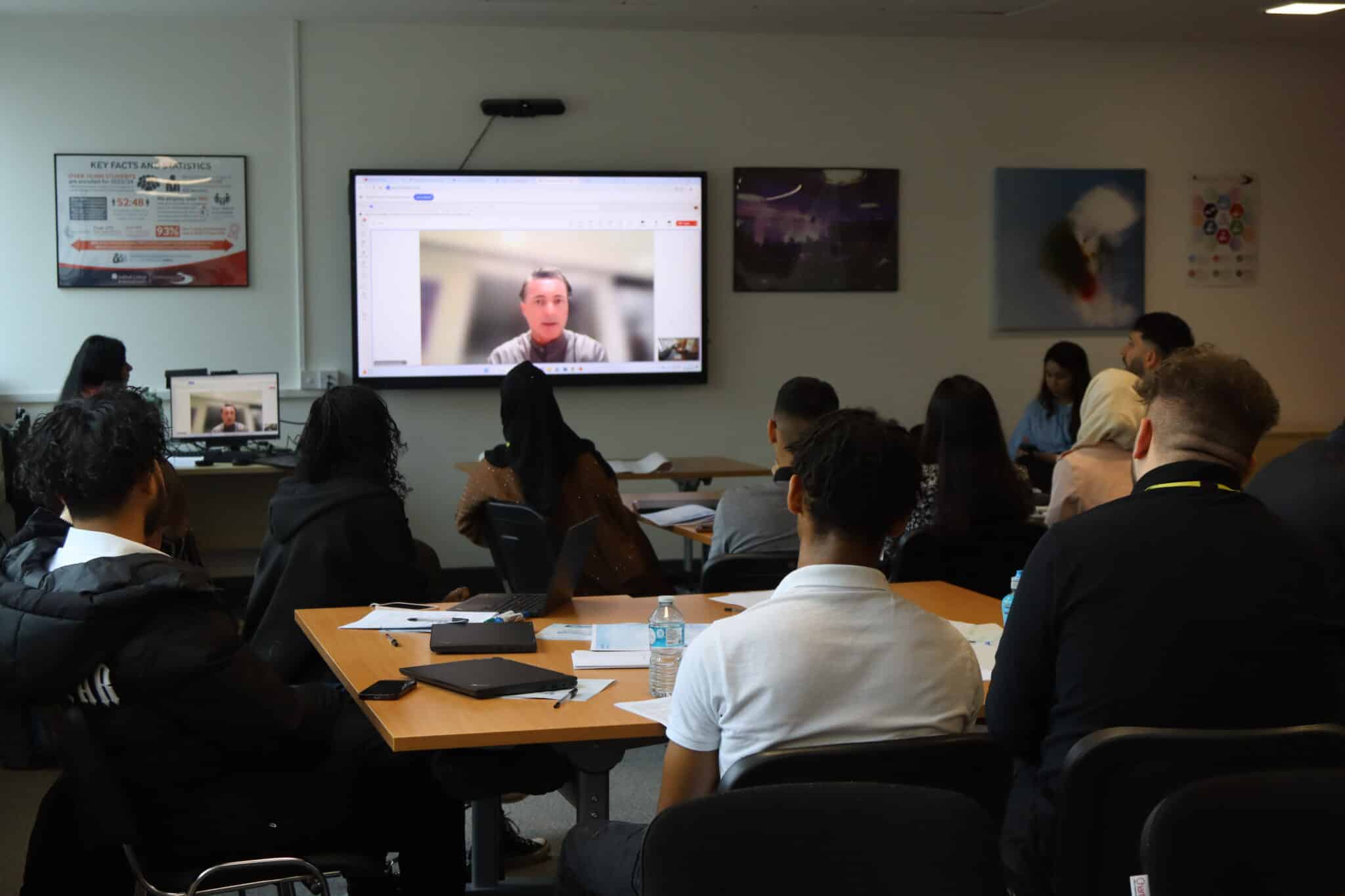 James Mcleary on a screen from Thailand chatting to the students